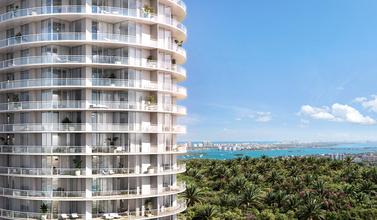 Curved tower balconies at One Park Tower with Biscayne Bay and the Miami skyline in the background