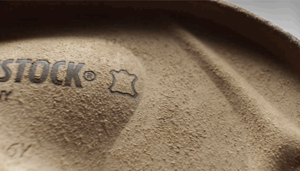 "Close-up of a Birkenstock leather footbed with brand stamp — The Charles Group campaign work"