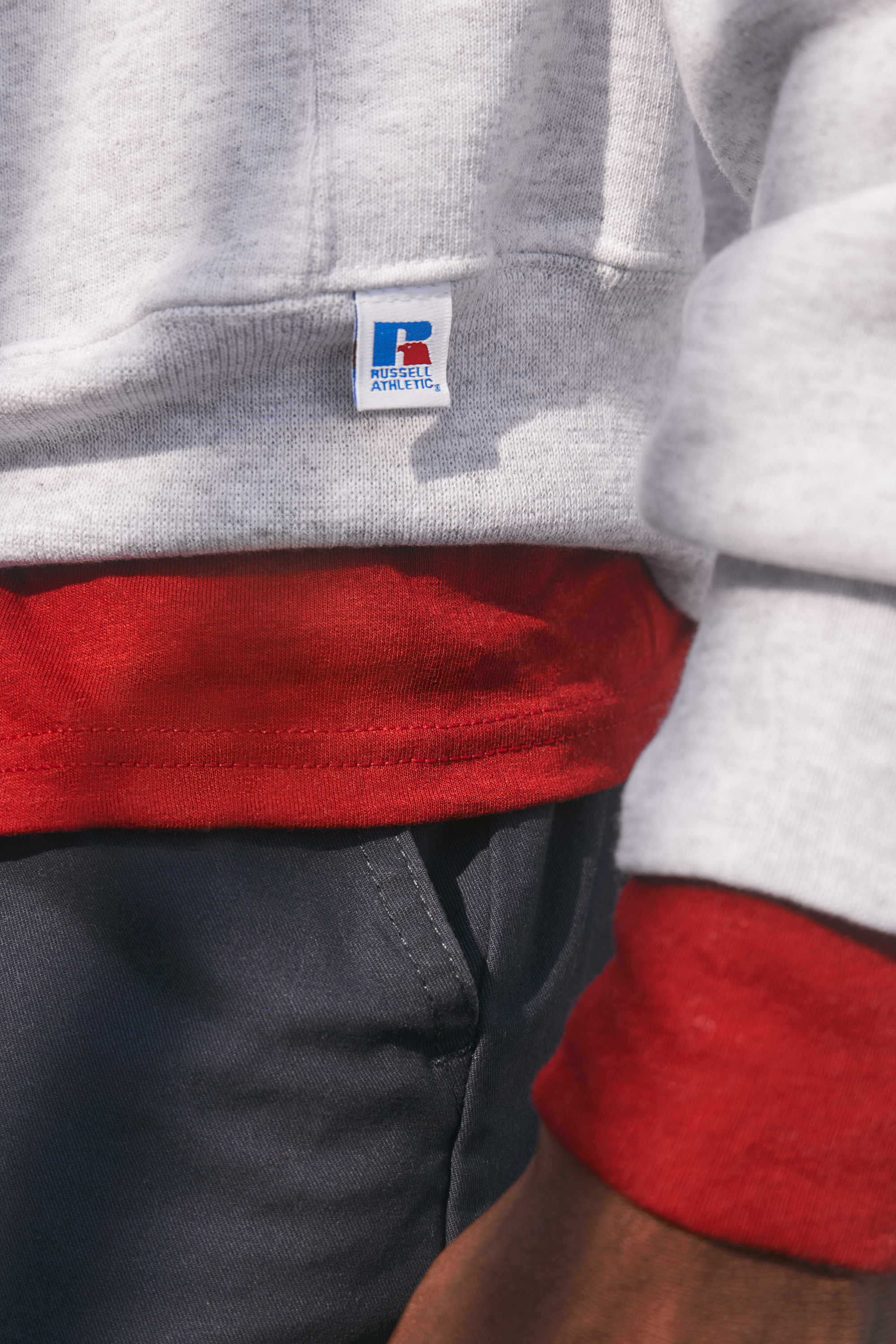 Athlete wearing Russell Athletic apparel in an action campaign shot, produced by The Charles Group