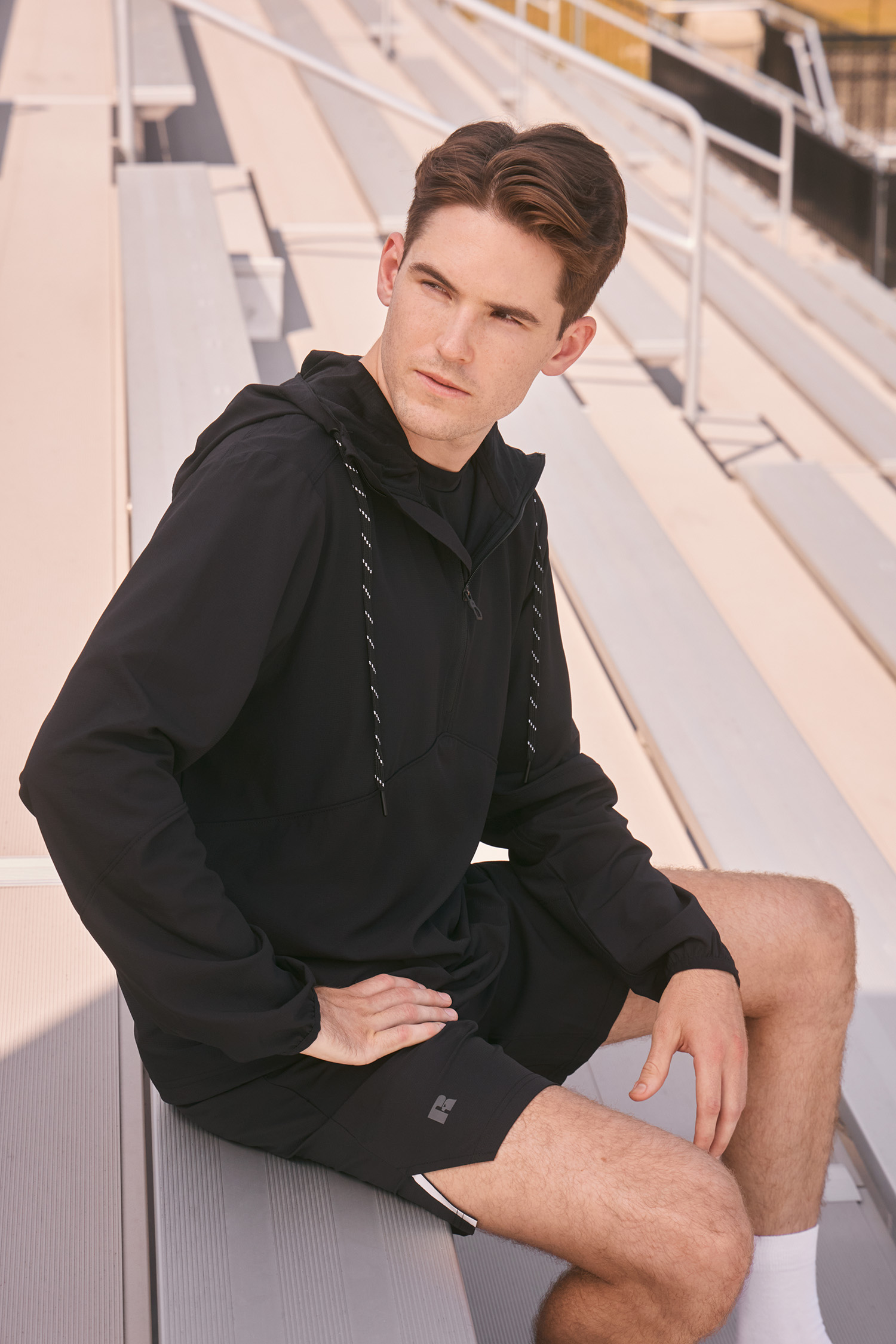 Detail shot of Russell Athletic apparel worn by an athlete, photographed by The Charles Group for brand refresh campaign