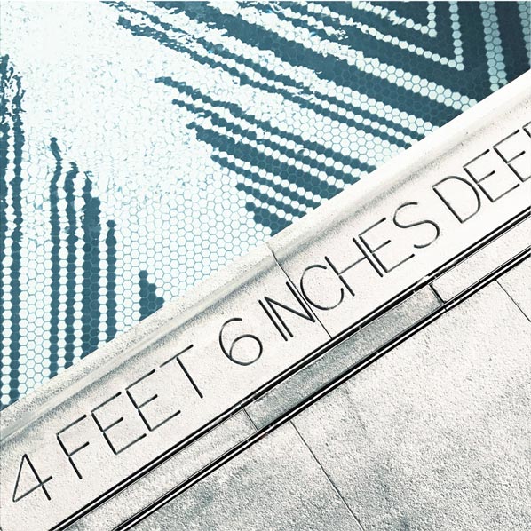 Close-up of the American Copper Buildings pool tile mosaic and depth marker reading '4 Feet 6 Inches Deep', social content by The Charles Group