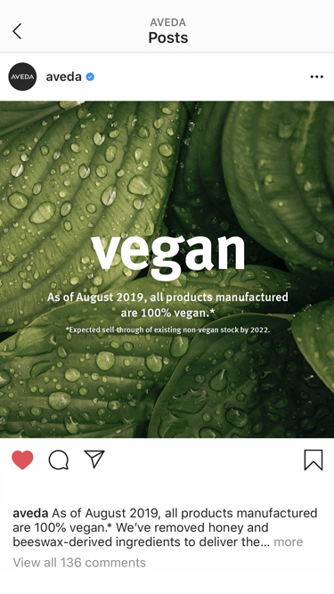 Aveda Instagram post on the 'vegan' announcement over a lush green leaf background, social content created by The Charles Group