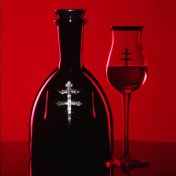D'ussé cognac bottle and branded snifter glass against a vivid red background, square format social content for D'ussé Holiday campaign by The Charles Group