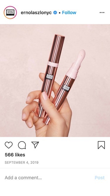 Erno Laszlo NYC Instagram post showing a hand holding two rose gold eye gel cream applicator pens