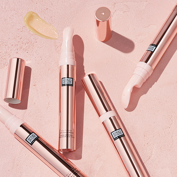 Erno Laszlo Multi-Tasking Eye Gel Cream rose gold tubes arranged in flatlay