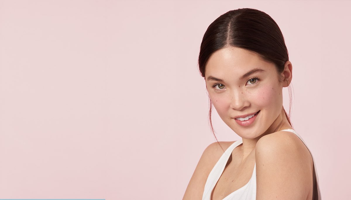 Woman with glowing skin smiling, shot for Erno Laszlo AHA Resurfacing Sleep Serum campaign by The Charles Group
