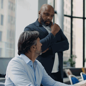 Two professionals collaborating on HP technology solutions