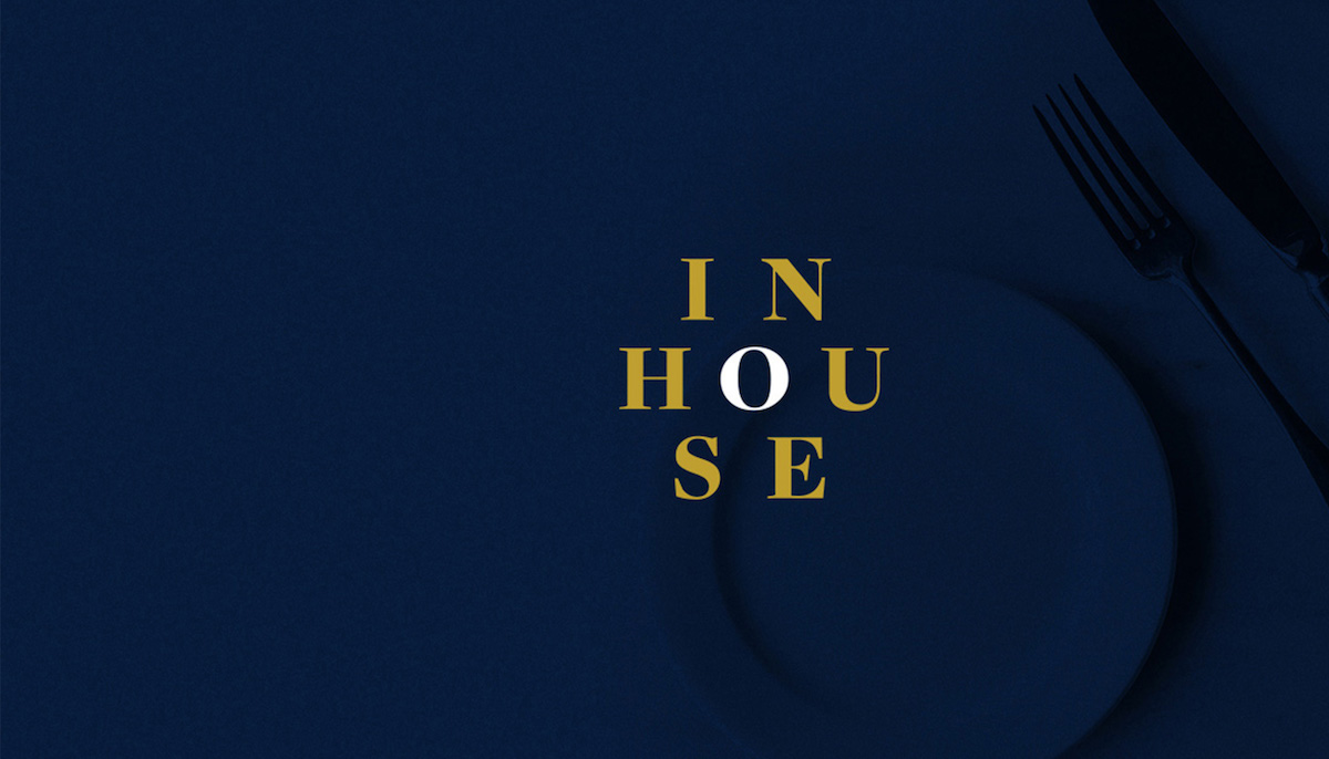 InHouse brand logo in gold and navy, designed by The Charles Group for a New York restaurant membership club