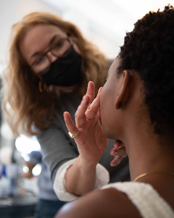 Behind-the-scenes photo from The Charles Group's Kjaer Weis organic beauty production shoot capturing the one-day multi-format filming