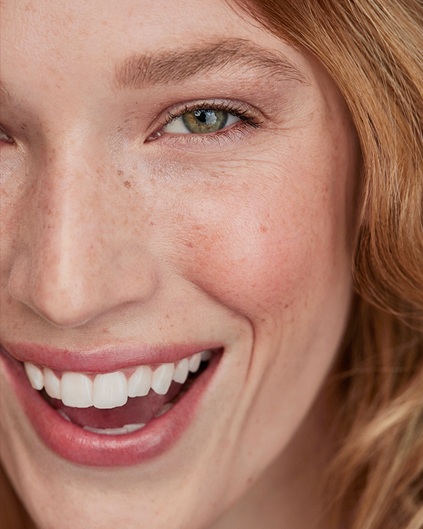 Model wearing Kjaer Weis Cream Blush Inner Glow, captured in beauty portrait photography by The Charles Group