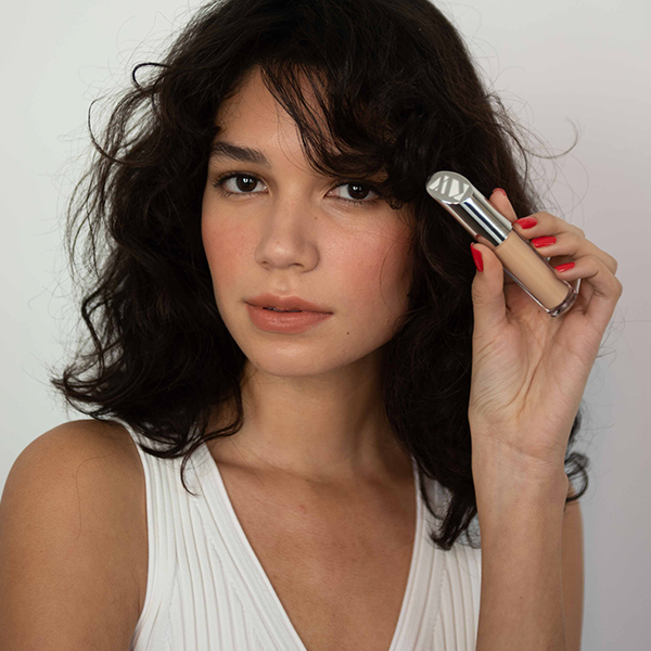 Kjaer Weis motion content video frame featuring organic beauty product in use, produced by The Charles Group