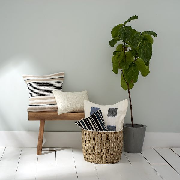 Threaded Home linen pillow collection lifestyle social content produced by The Charles Group, featuring neutral stripe and indigo accent pillows