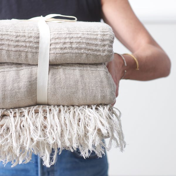 Threaded Home folded linen throws product social content produced by The Charles Group for DTC paid media and organic channels