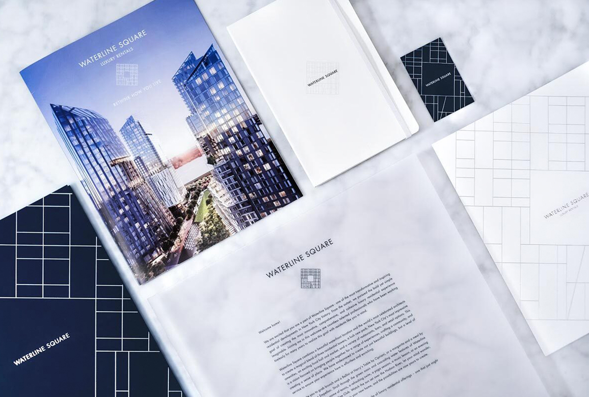 Waterline Square luxury rental welcome packet and branded stationery including brochure, notebook, business cards, and letterhead, designed by The Charles Group