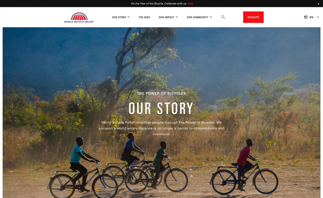 World Bicycle Relief "Our Story" web page with a group of children riding bicycles through a rural African landscape