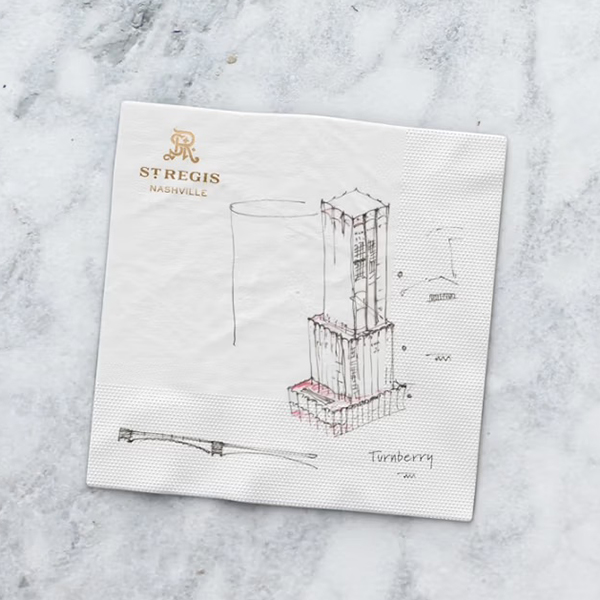 Turnberry architectural sketch on a St. Regis Nashville cocktail napkin, featured in The Charles Group brand storytelling campaign