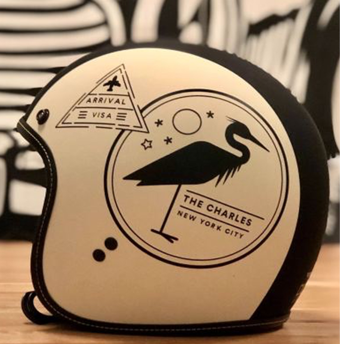 Custom branded motorcycle helmet featuring The Charles New York City logo