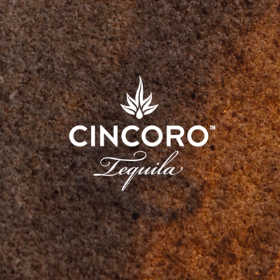 Cincoro Tequila logo emerging from a warm amber-toned textured background in a branded motion sequence