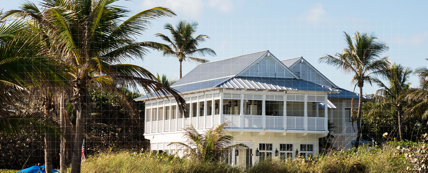 Exterior of The Seagate Delray beachfront property surrounded by palm trees on Florida's coast